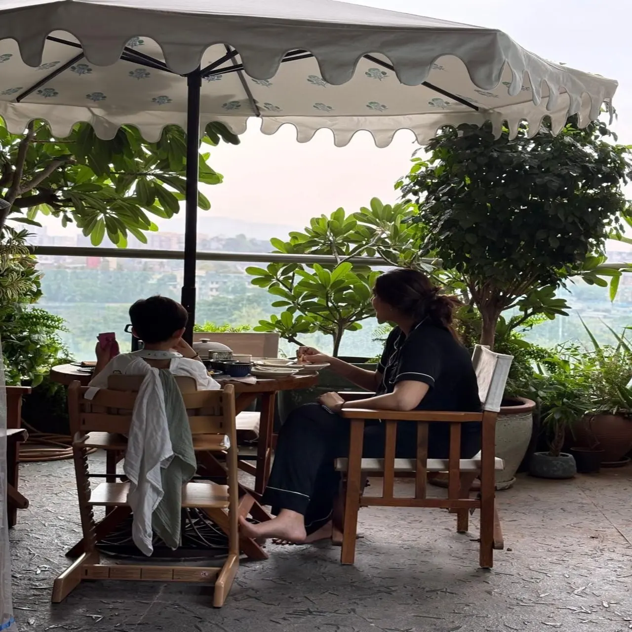 In the first picture she uploaded on Instagram, Sonam Kapoor is seen having a blissful breakfast with her elder son, Vayu, in her scenic balcony, surrounded by plants